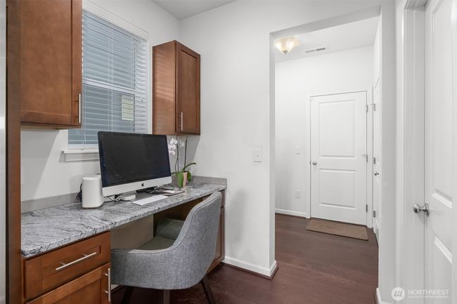 The kitchen command center is a bonus! It's a built-in work-from-home space, homework station, or household management hub conveniently nestled between the kitchen and mudroom leading to the garage! | Image 12