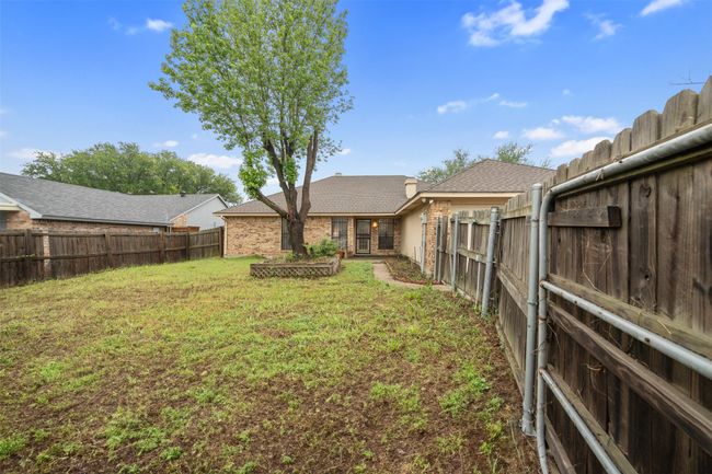 View of yard with a fenced backyard | Image 22