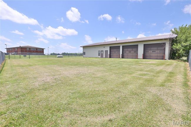 View of yard & fenced in area | Image 53