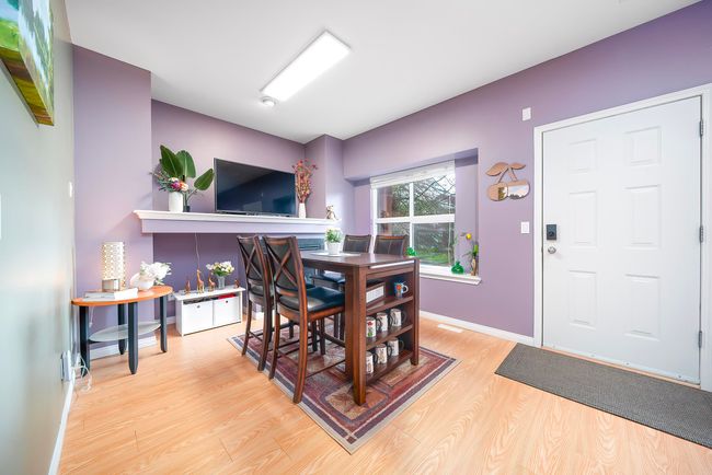 Dining area with baseboards and light wood-style floors | Image 12