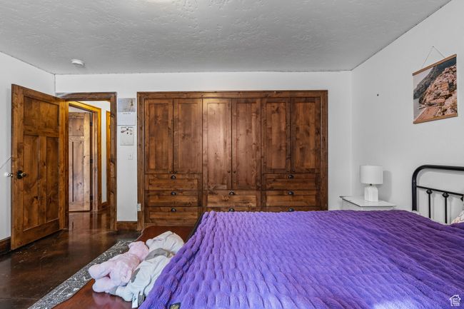 Bedroom featuring a textured ceiling | Image 46