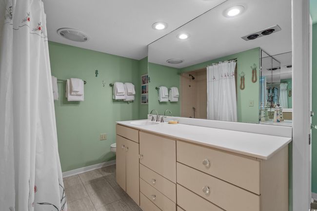 Bathroom featuring visible vents, baseboards, toilet, recessed lighting, and vanity | Image 24