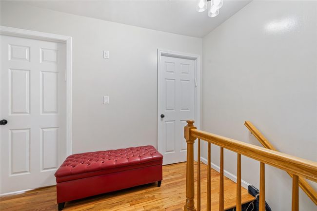 Sitting room featuring an upstairs landing and light wood-type flooring | Image 29