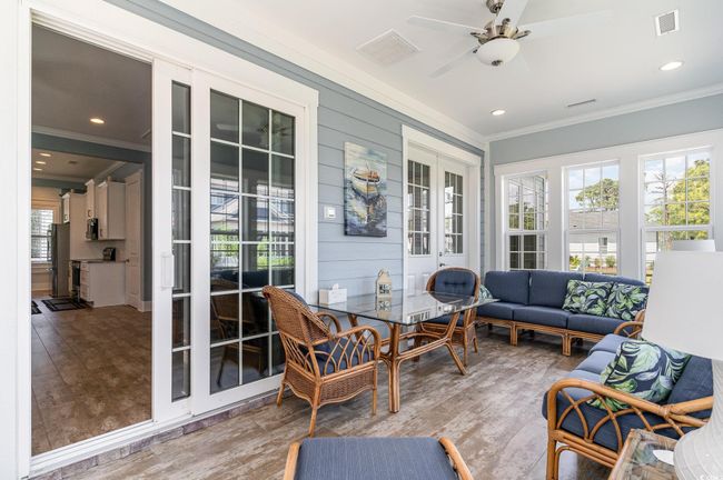 Sunroom with ornamental molding, visible vents, and plenty of natural light | Image 22