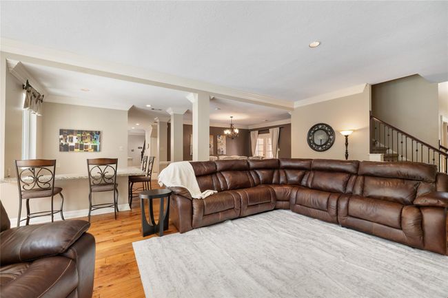 With a layout designed for both flow and function, the living room effortlessly connects to the wet bar and formal dining room, making it easy to gather, entertain, or simply enjoy daily living. | Image 12