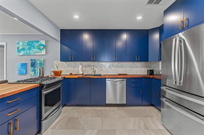 Kitchen featuring wood counters, stainless steel appliances and recessed lighting | Image 6