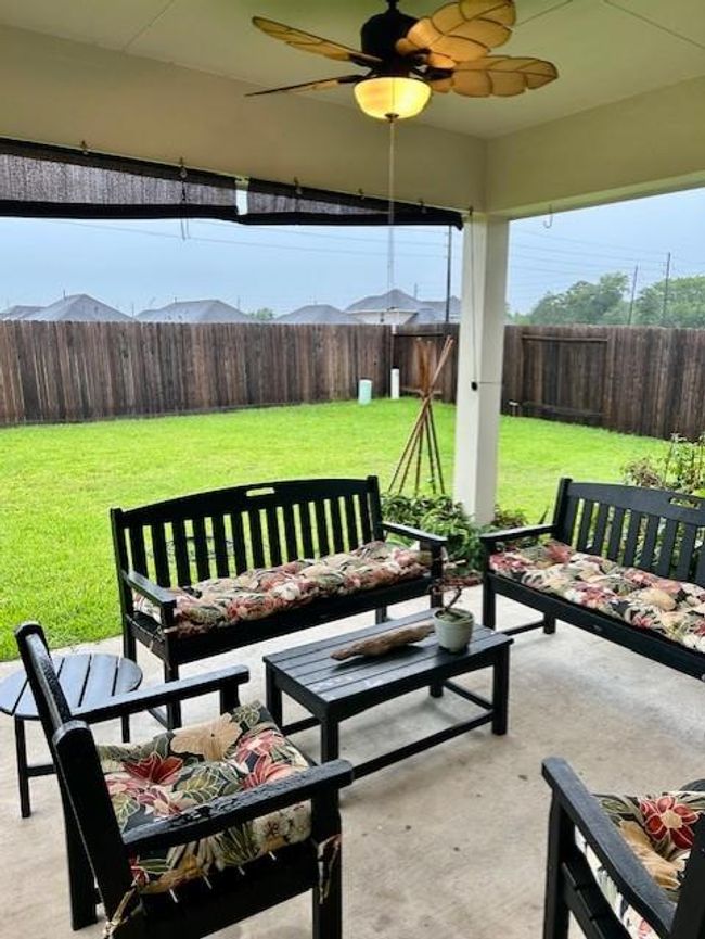 Enjoy a refreshing drink with friends in this inviting and spacious outdoor patio. | Image 25