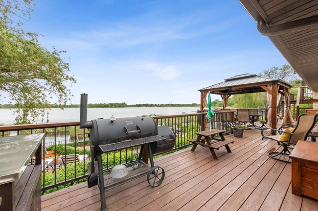Entertaining deck and patio that leads onto the expansive dock perfect for summer water activites | Image 4