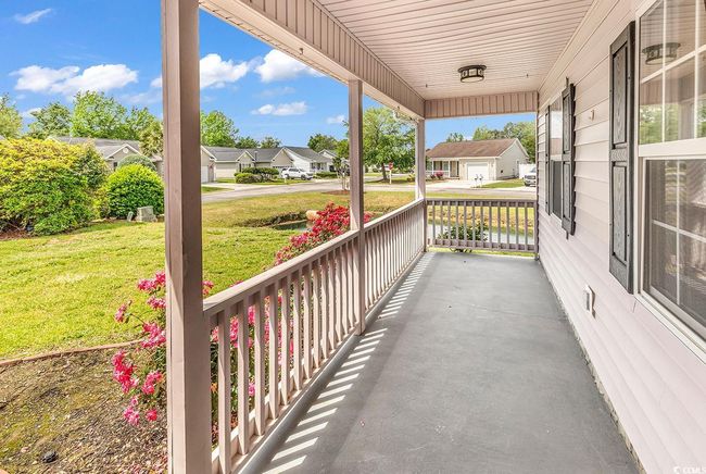 View of patio featuring a porch and a residential view | Image 19