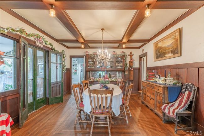 Flow from the living room through French doors to your peaceful front porch—perfect for morning coffee. | Image 5