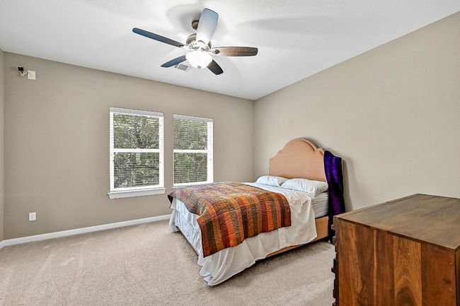 Bedroom featuring carpet flooring and ceiling fan | Image 31