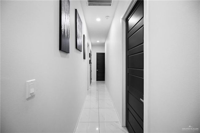 Hall featuring light marble finish floors, baseboards, and recessed lighting | Image 16