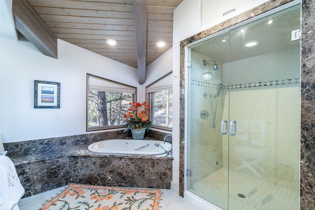 Bathroom featuring plus walk in shower and wood ceiling | Image 20