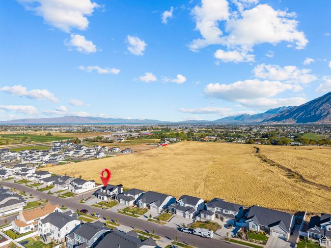 Aerial perspective of suburban area with a mountainous background | Image 65