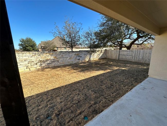 View of yard featuring a patio and a fenced backyard | Image 26
