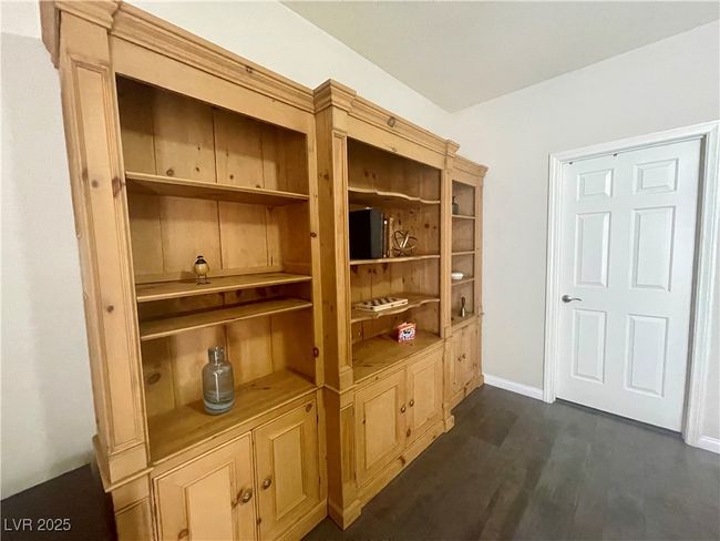 Room details with baseboards and wood finished floors | Image 31