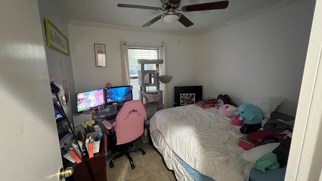 Bedroom with ornamental molding and a ceiling fan | Image 8