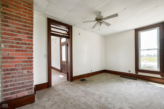 spare room with carpet floors and a ceiling fan | Image 15