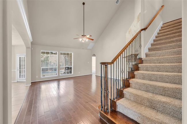 This stunning home features a wrought iron stairway, adding an elegant touch to its charm. | Image 5