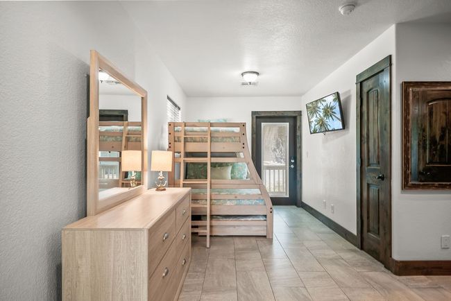 Entrance/bonus room with utility closet and storage room. Rear door leads to back of house, green space and pool. | Image 8