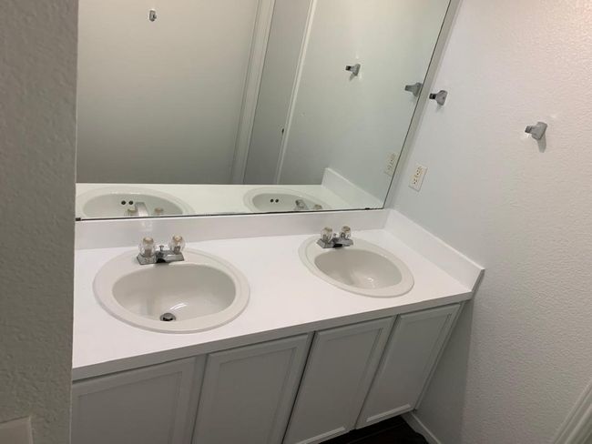 Bathroom featuring double vanity | Image 14