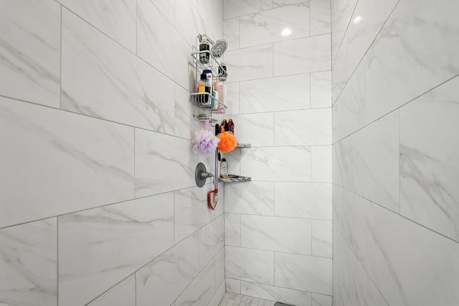 Full bathroom with a tile shower | Image 23