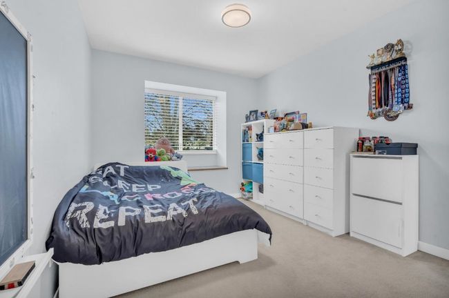 Bedroom featuring light carpet | Image 18