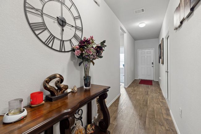 Hallway featuring dark wood-vinyl-style floors and baseboards | Image 15