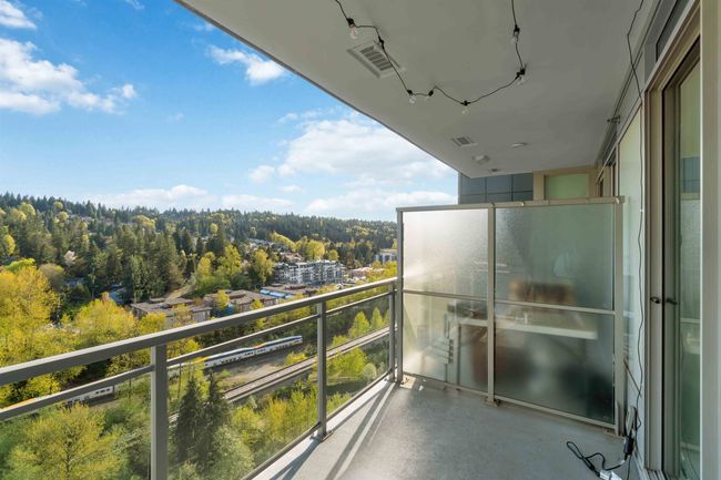 Balcony with visible vents and a forest view | Image 24