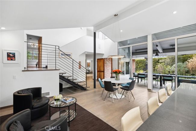 A double-height foyer with impressive floating staircase flows effortlessly to living areas that are bathed in natural light | Image 7