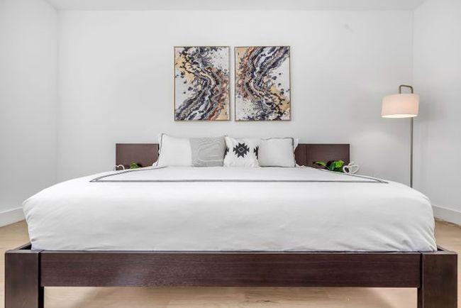 Bedroom with wood-type flooring | Image 29