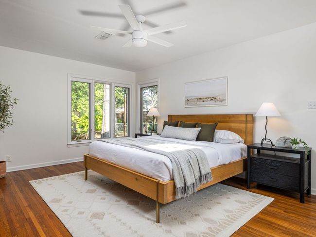 Bedroom featuring wood floors and a ceiling fan | Image 14