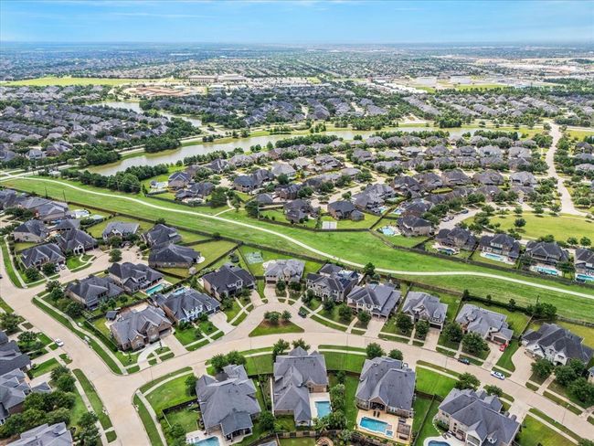 East facing oversized lot with green space across the street and steps away from lakes and trails. Walking distance to top rated Katy ISD schools (elementary shown in top left of photo as well as shops and restaurants located off Fry Rd & FM 1463). Easy access to Westpark Tollway and Texas Heritage | Image 46