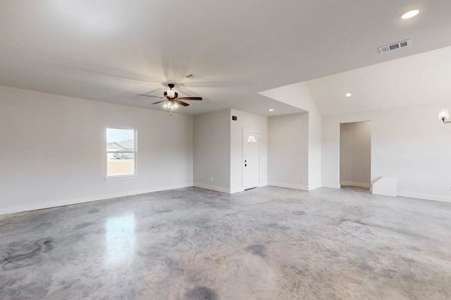 Spare room with concrete floors, a ceiling fan, visible vents, and recessed lighting | Image 9