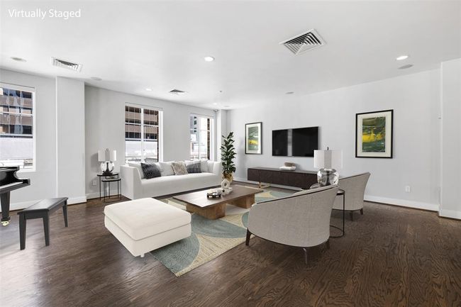 Ideal living room with a many seating options. | Image 11