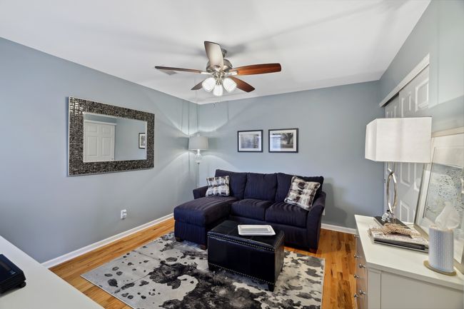 Bedroom 3 is currently being used as a sitting room, and has a large double closet and a door leading to the hall bath. | Image 30