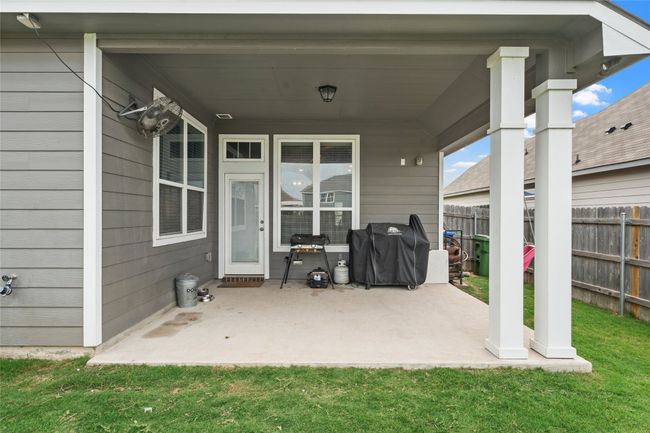 View of patio featuring area for grilling | Image 22