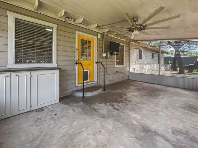 Unfurnished sunroom featuring a ceiling fan | Image 14