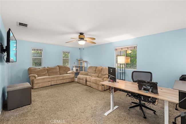 Loft with Windows to Front of Home and Side Yard | Image 19