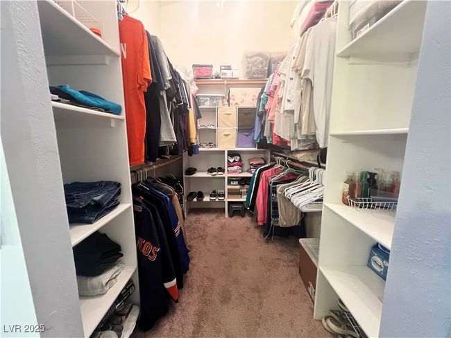 Walk in closet featuring carpet flooring | Image 31