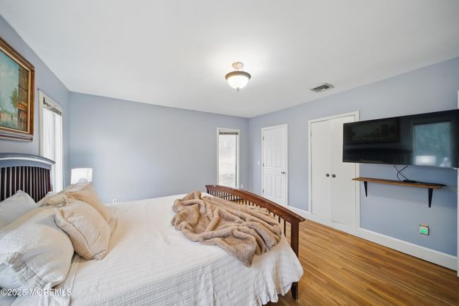 Primary Bedroom with Newer Bathroom with 2 sinks & great design, large windows & builtins in large closets. | Image 21