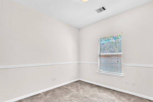 Empty room featuring baseboards and light tile patterned floors | Image 21