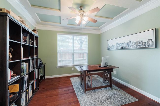 Study features double French doors and wood flooring. | Image 10