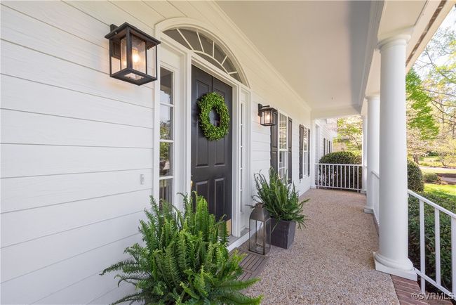 View of exterior entry with covered porch | Image 5