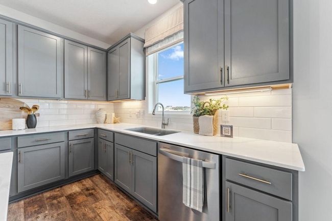 Upgraded Signature Kitchen includes: Double wall oven, gas cooktop, microwave w/air fryer and dishwasher. Jameson floor plan. Photo of previously built home; finishes, selections, colors, and floorplan to vary. | Image 5