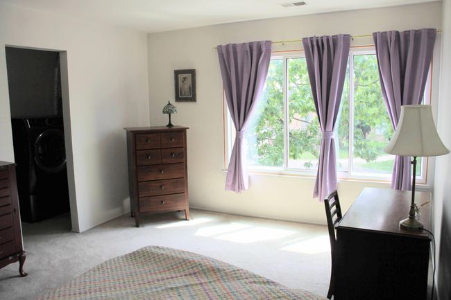 primary bedroom. curtains stay if you want them. | Image 11