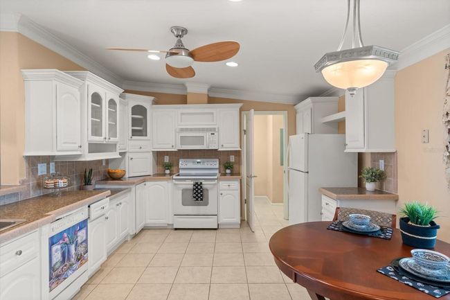 Kitchen looking into Inside Laundry Room | Image 9