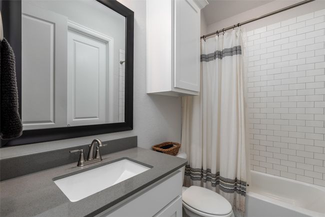 Full bath with vanity, toilet, and shower / bath combo | Image 23