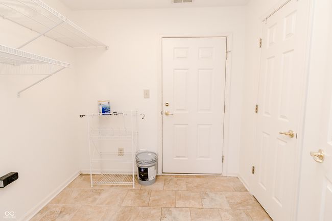 laundry room with baseboards and visible vents | Image 28