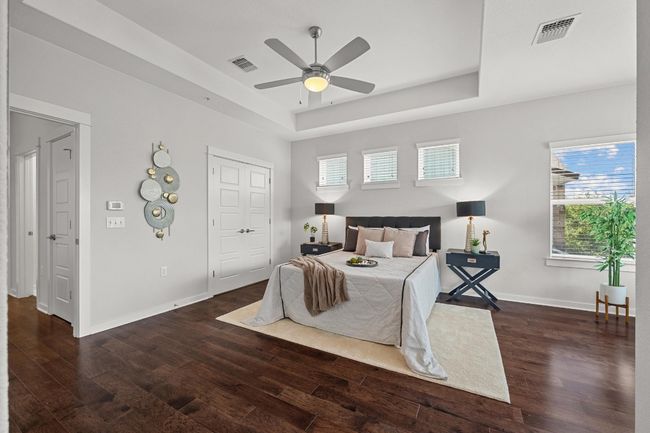 Large enough to fit a king-sized bed, the primary bedroom offers a sense of openness while still feeling intimate and welcoming | Image 25